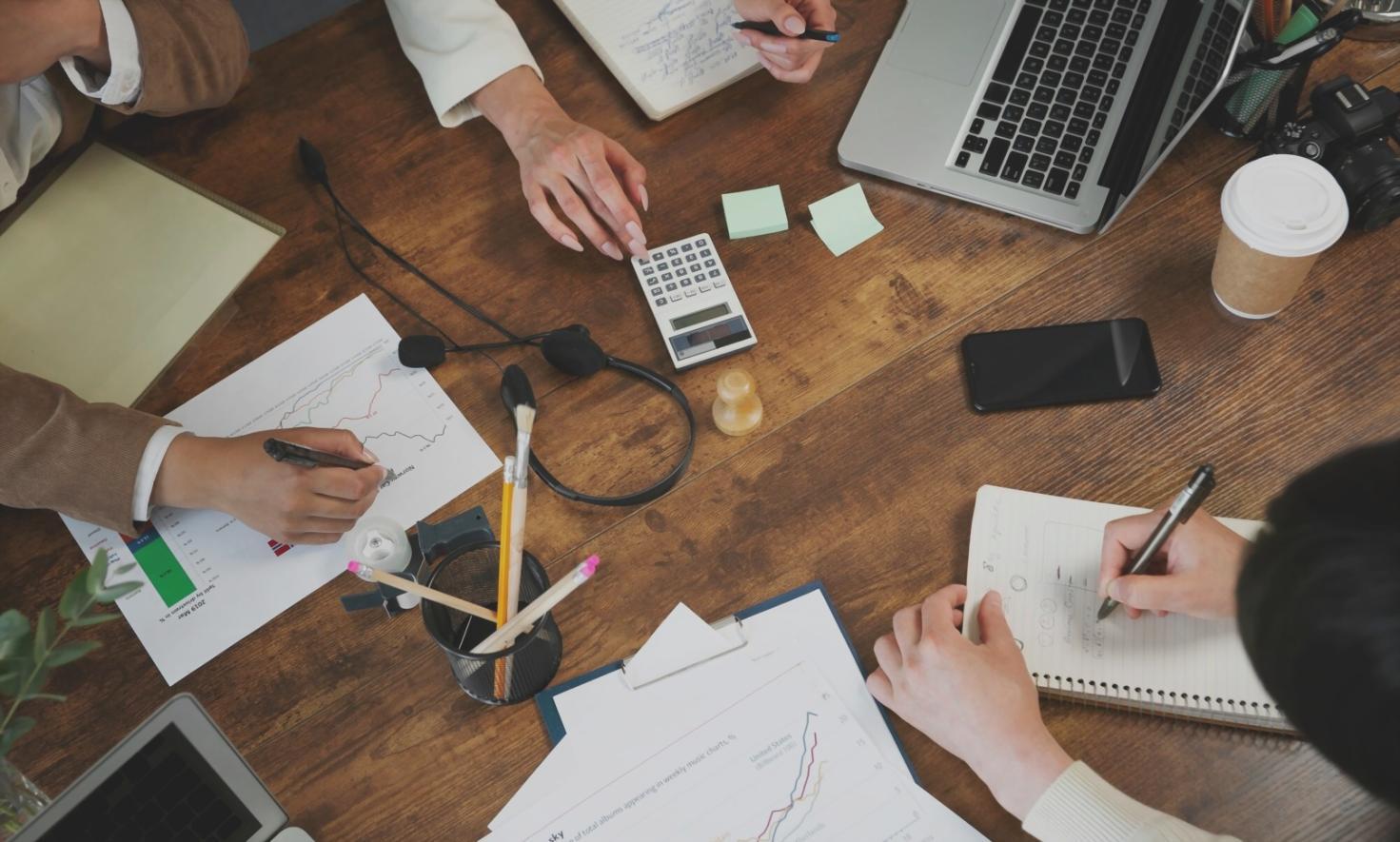 Financial team reviewing investment reports in modern office